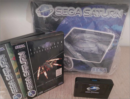 Boxed Sega Saturn with a couple of Video Games and a Memory Cartridge...